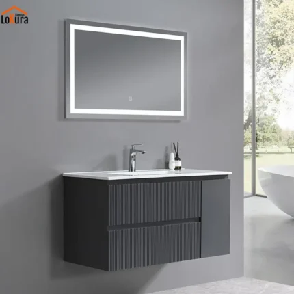 Mueble lavabo con espejo y luz color gris suspendido con dos cajones en baño moderno en Canarias