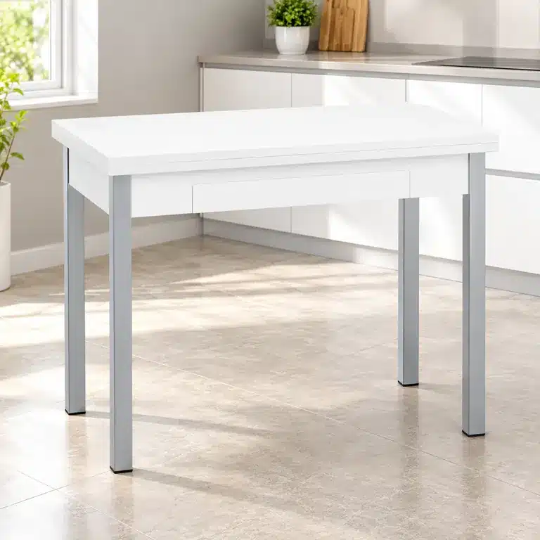 Mesa libro blanca y plata cerrada en una cocina pequeña